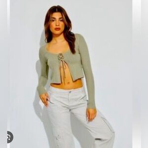 Garage soft green hue and a trendy tie-front